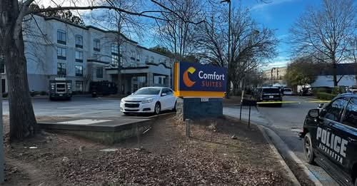 A murder suspect locked himself inside a Comfort Suites hotel room in Alpharetta on Monday afternoon, refusing to exit when FBI agents arrived to arrest him